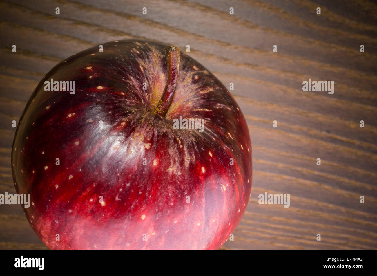 red apple on a wood surface Stock Photo - Alamy