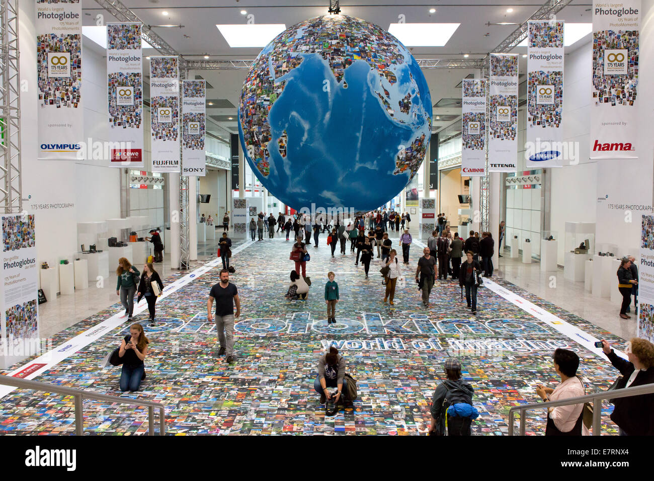 Photographs from all over the world under a huge globe at the trade fair Photokina in Cologne, in September 2014. Stock Photo