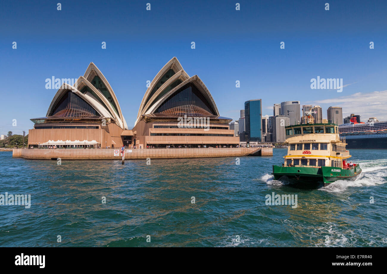 Sydney Opera House photographed from the harbour, withSydney ferry Alexander, the CBD and Queen Mary 2. Stock Photo