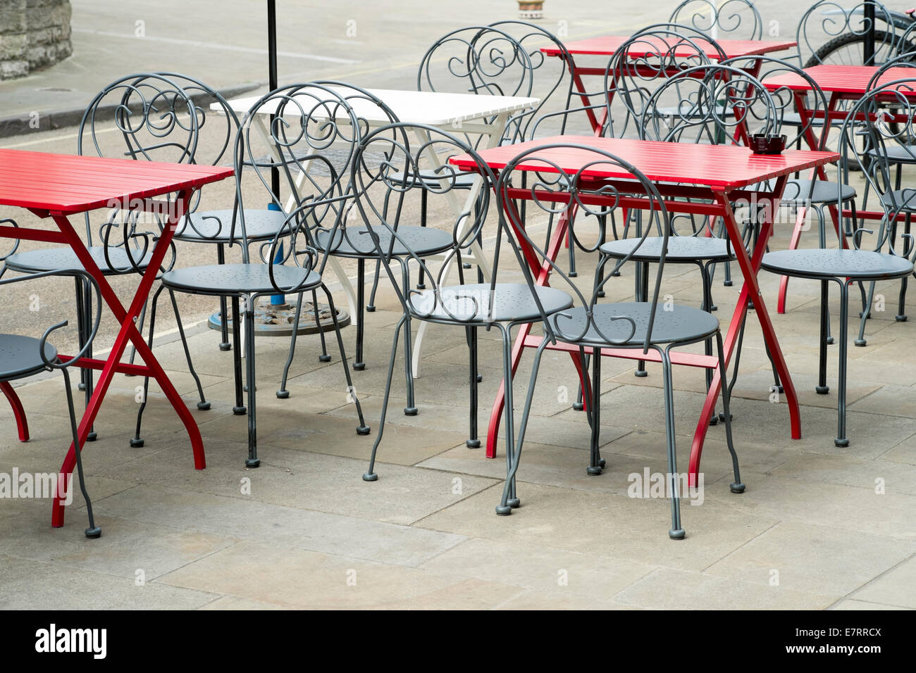 Empty tables and chairs on UK pavement Stock Photo