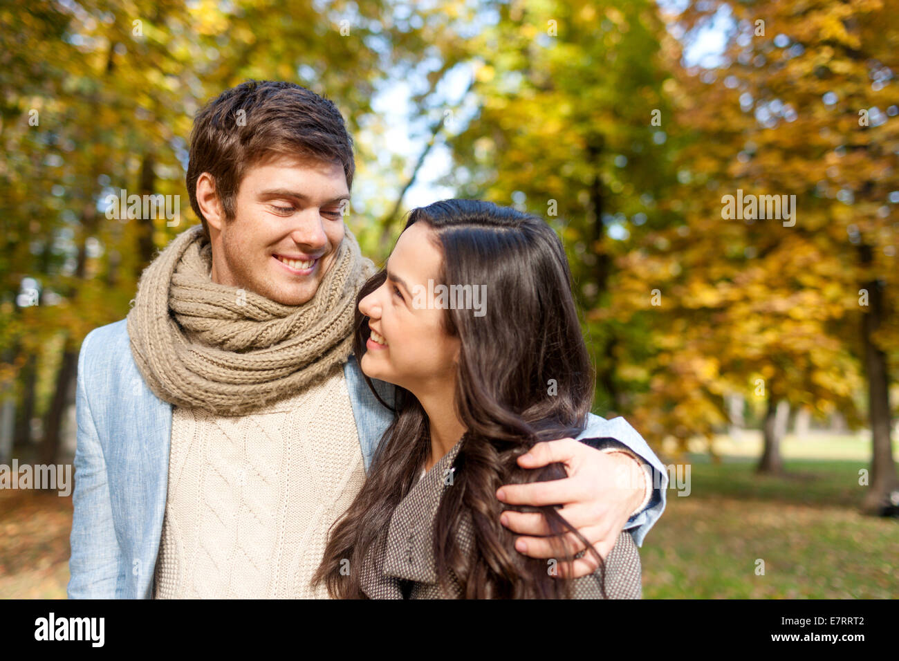 smiling couple hugging in autumn park Stock Photo - Alamy