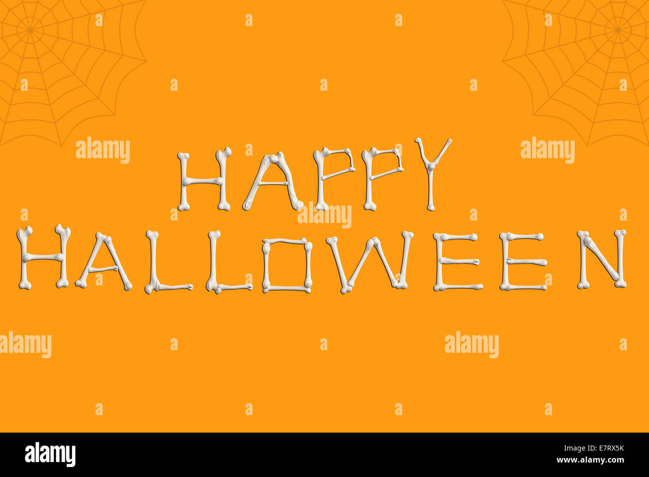 Text design element, Happy Halloween spelled out in bones on orange background with spider webs. Stock Photo