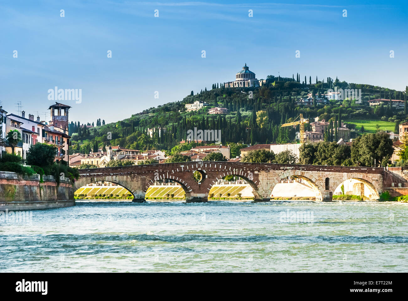 Sanctuary of the Madonna of Lourde, Verona, Italy, over the river with an ancient bridge . Stock Photo