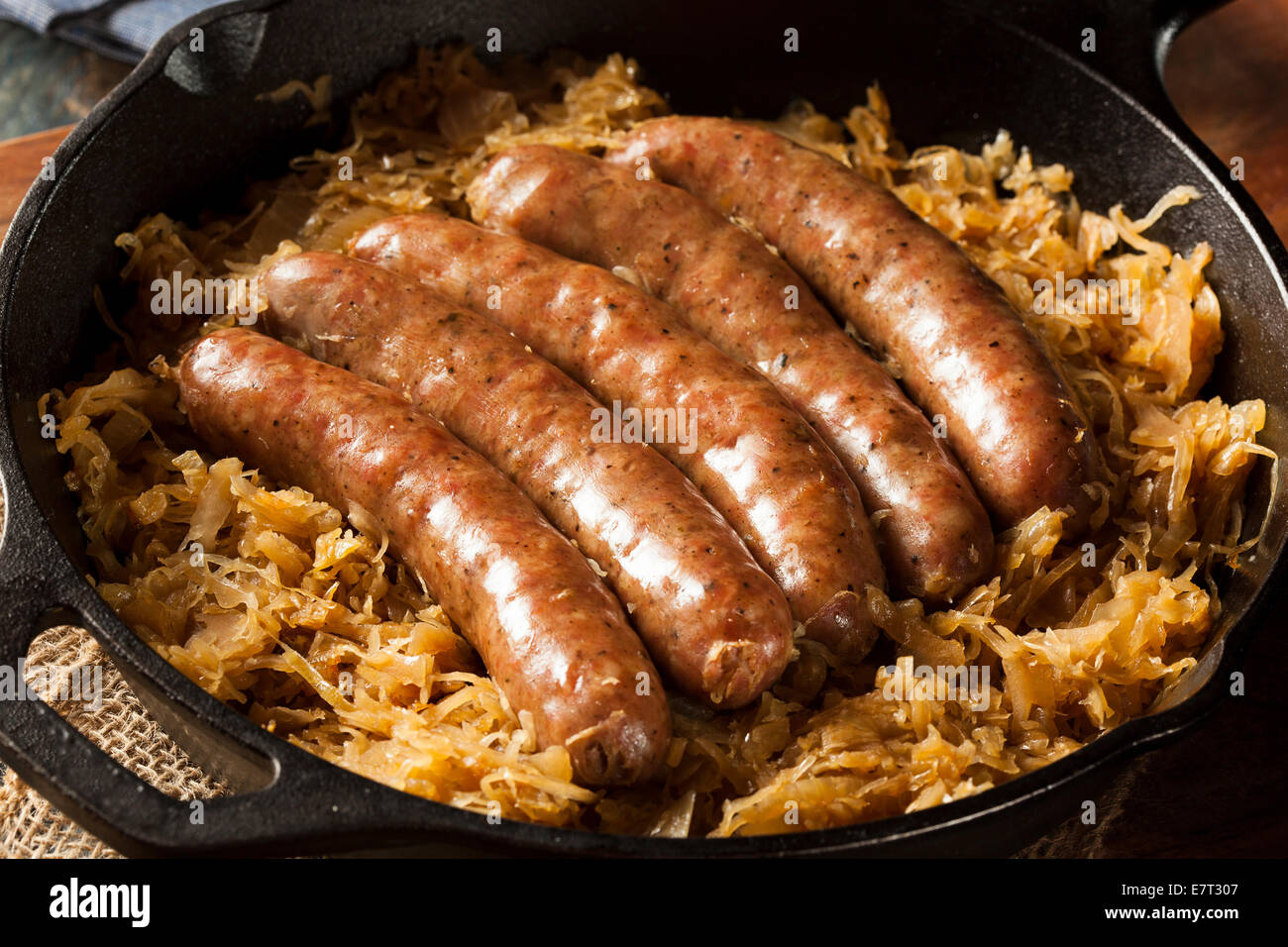 Roasted Beer Bratwurst with Saurkraut in a Pan Stock Photo