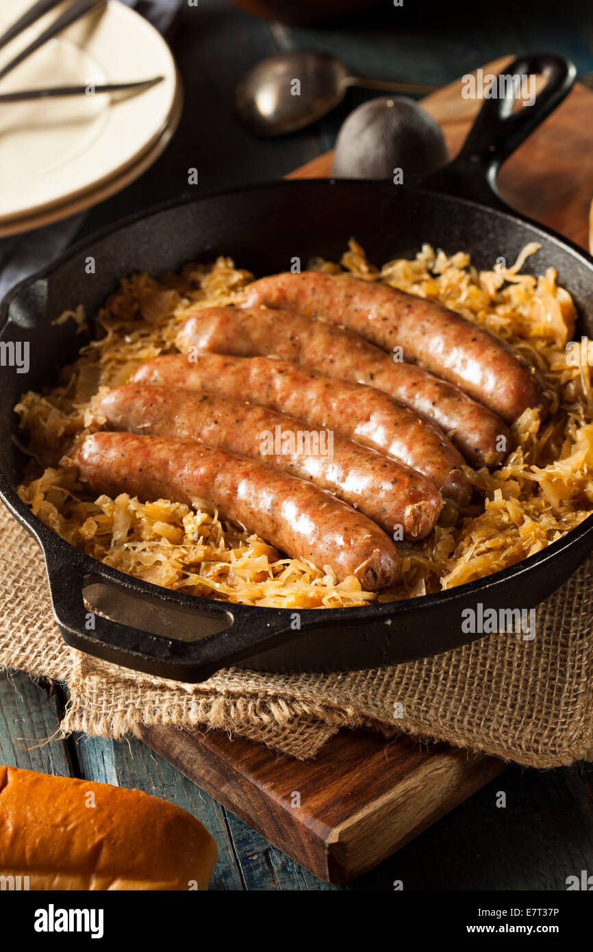 Roasted Beer Bratwurst with Saurkraut in a Pan Stock Photo