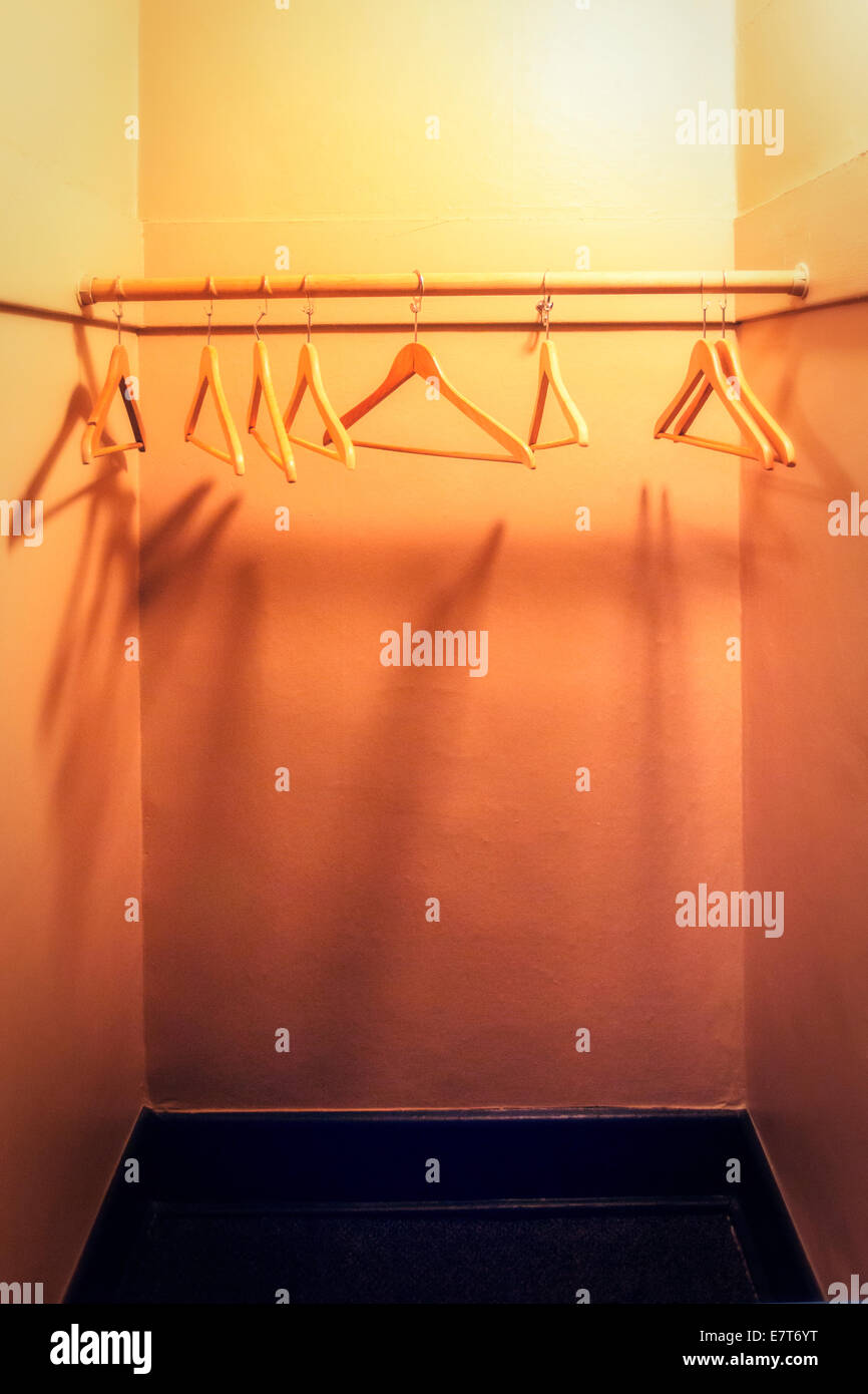 Empty closet with wooden hangers Stock Photo