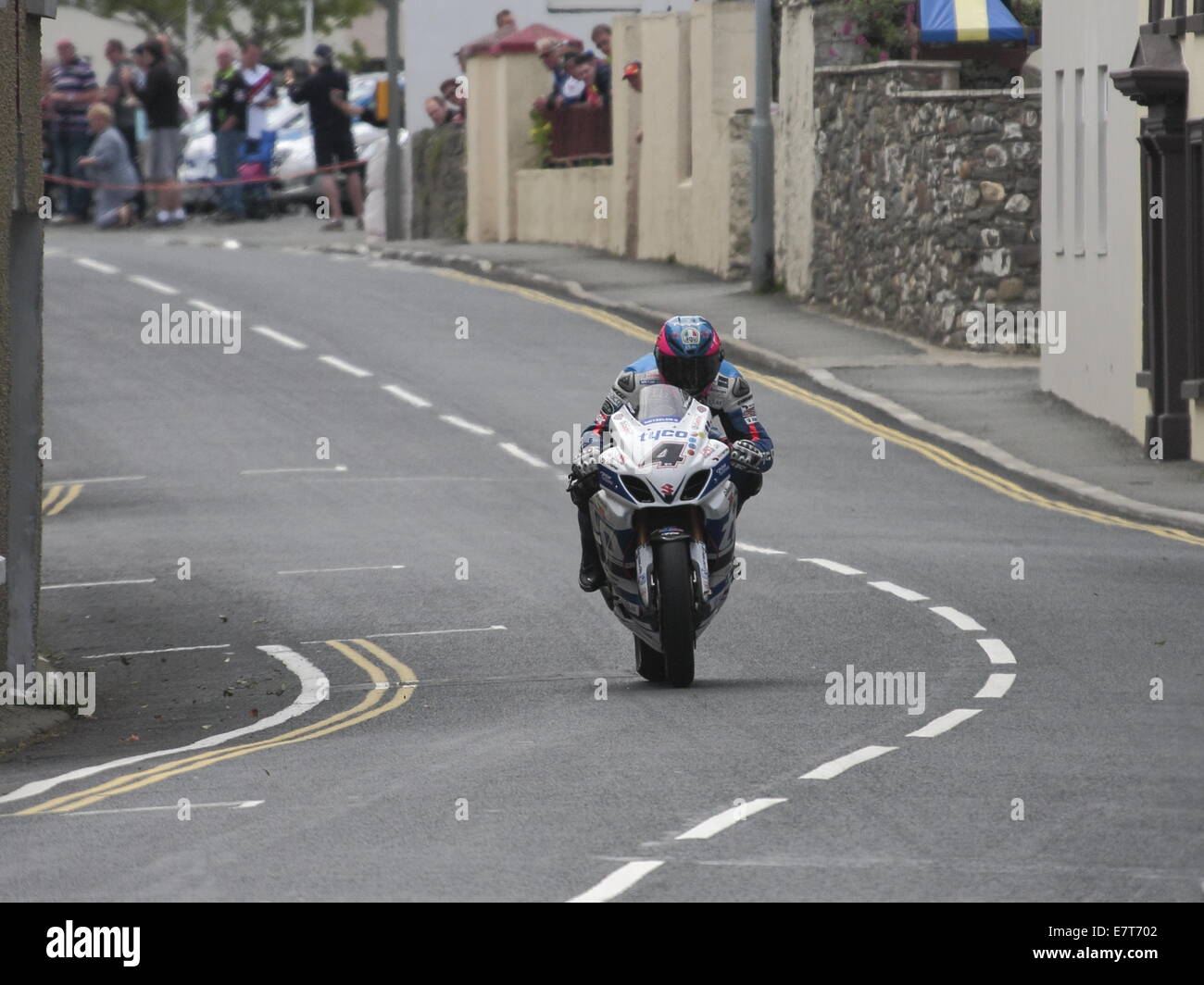 Guy Martin riding his Tyco Suzuki in the Seniors race, during the 2014 Isle of Man TT. Stock Photo
