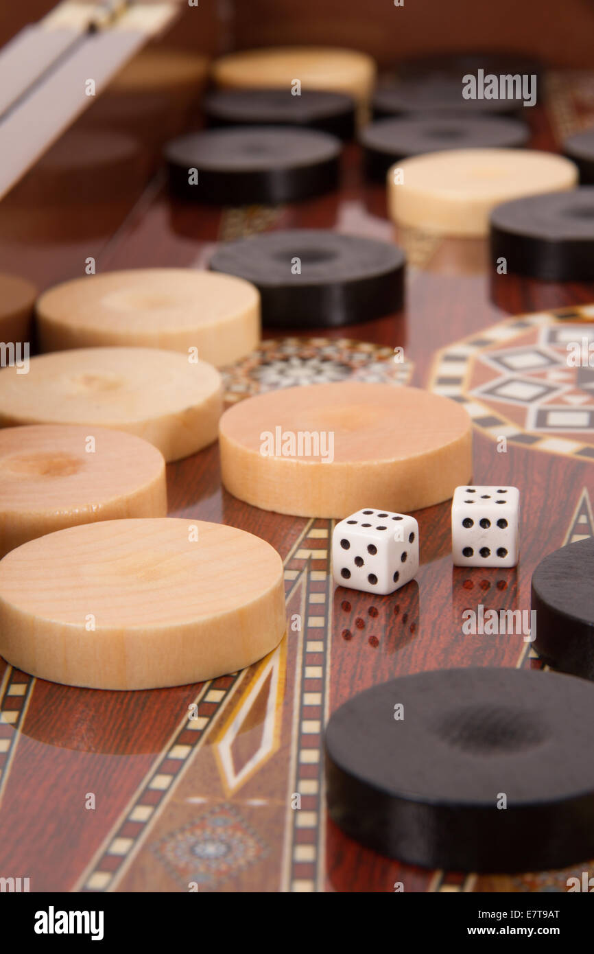 Complicated backgammon chips and dices with six and five. Stock Photo