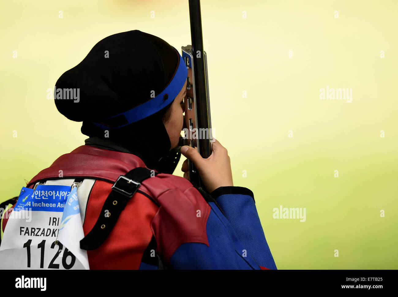 Incheon, South Korea. 24th Sep, 2014. Farzadkhah Dina of Iran competes during the 50m rifle prone women's competition at the 17th Asian Games in Incheon, South Korea, Sept. 24, 2014. Credit:  Lin Yiguang/Xinhua/Alamy Live News Stock Photo