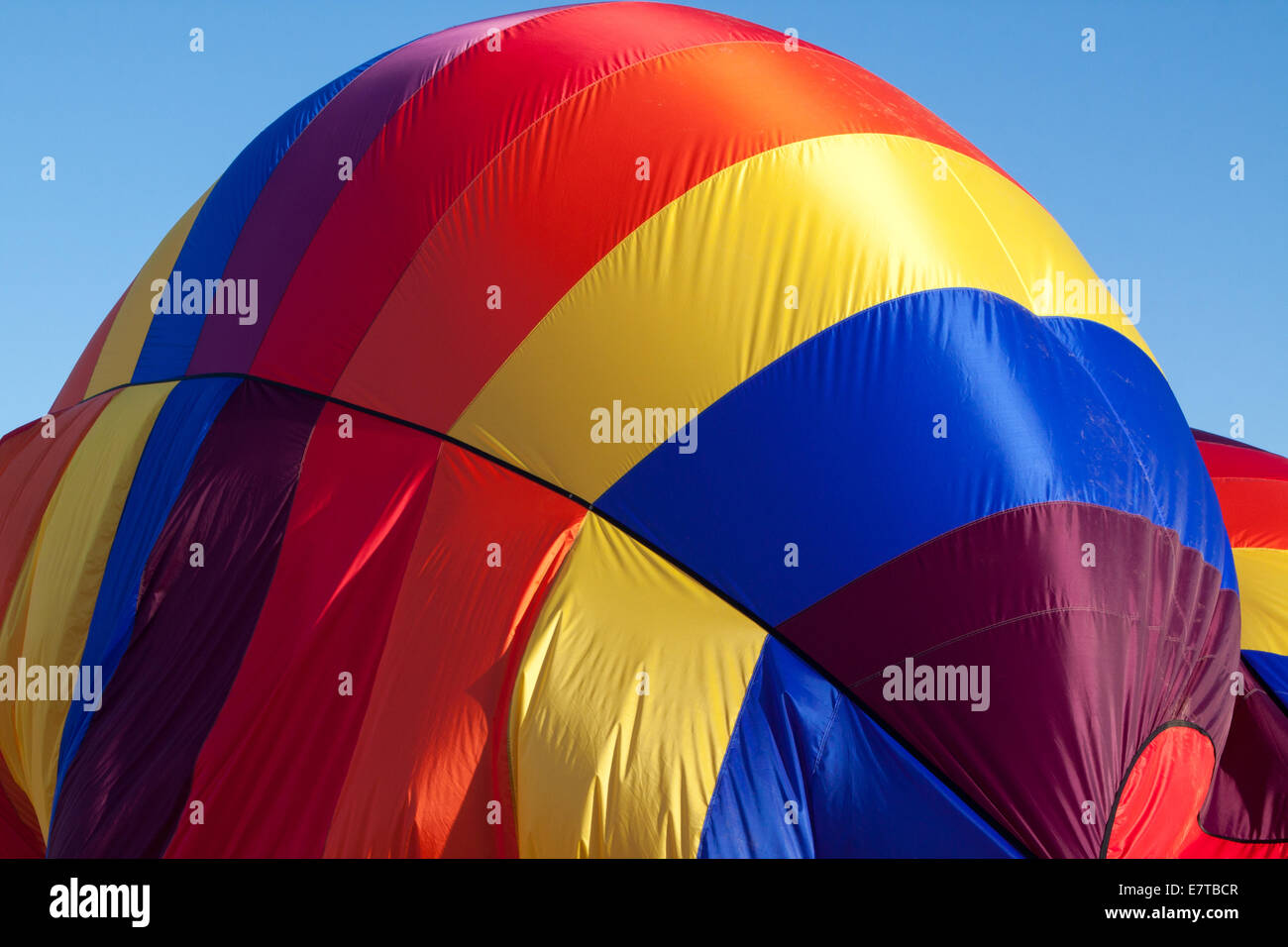 Canopy of a hot-air balloon being collapsed Stock Photo