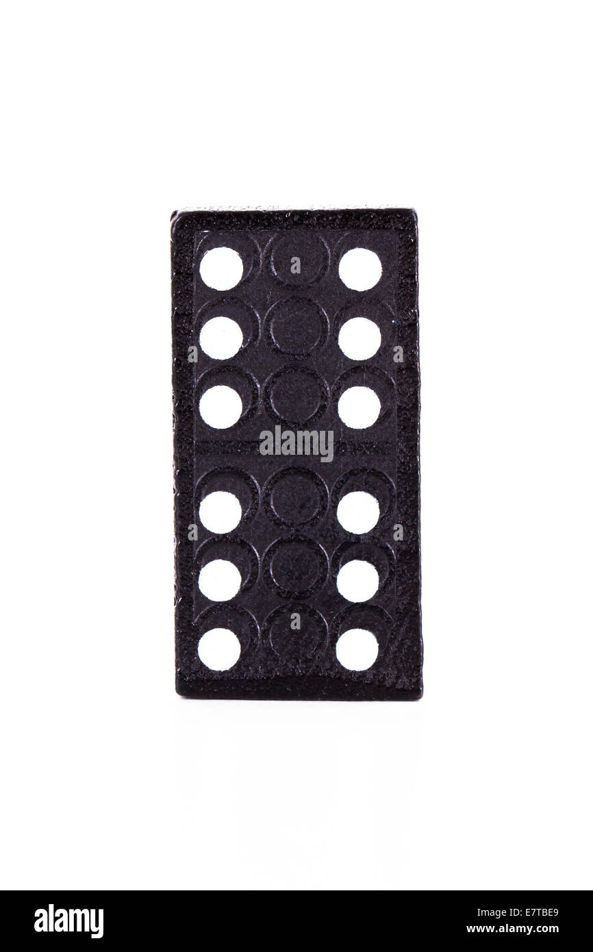 Single black domino, isolated on white background. Stock Photo