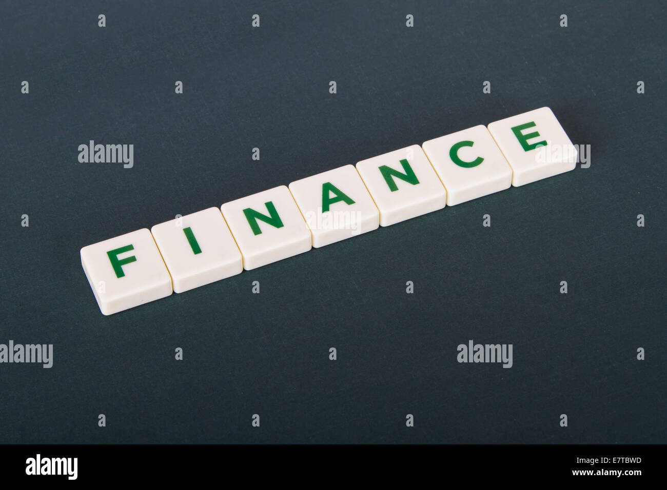 Finance word in letters on background. Stock Photo