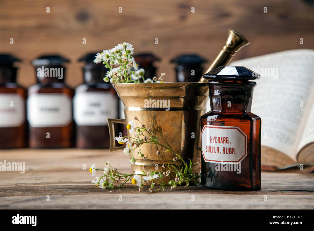 The ancient natural medicine, herbs, medicines and old book Stock Photo