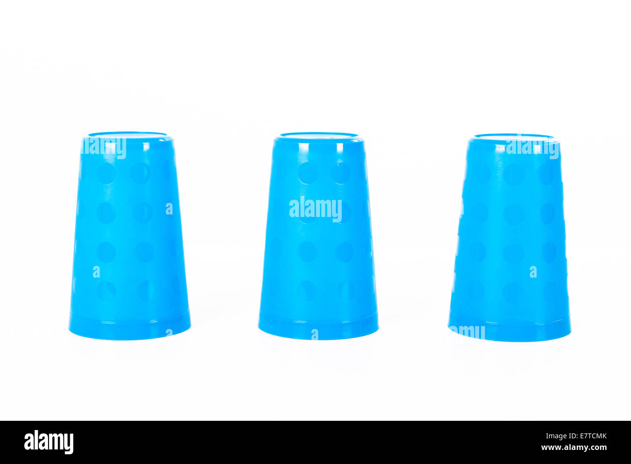 Thimblerig with three plastic glasses, isolated on white background ...