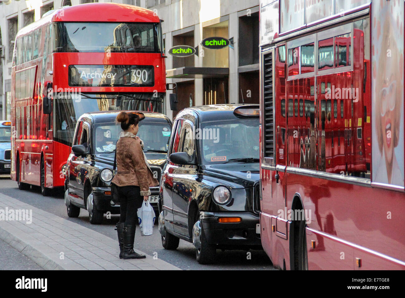 England: Double-decker buses and cabs in London's Oxford Street. Photo from 10. January 2014. Stock Photo