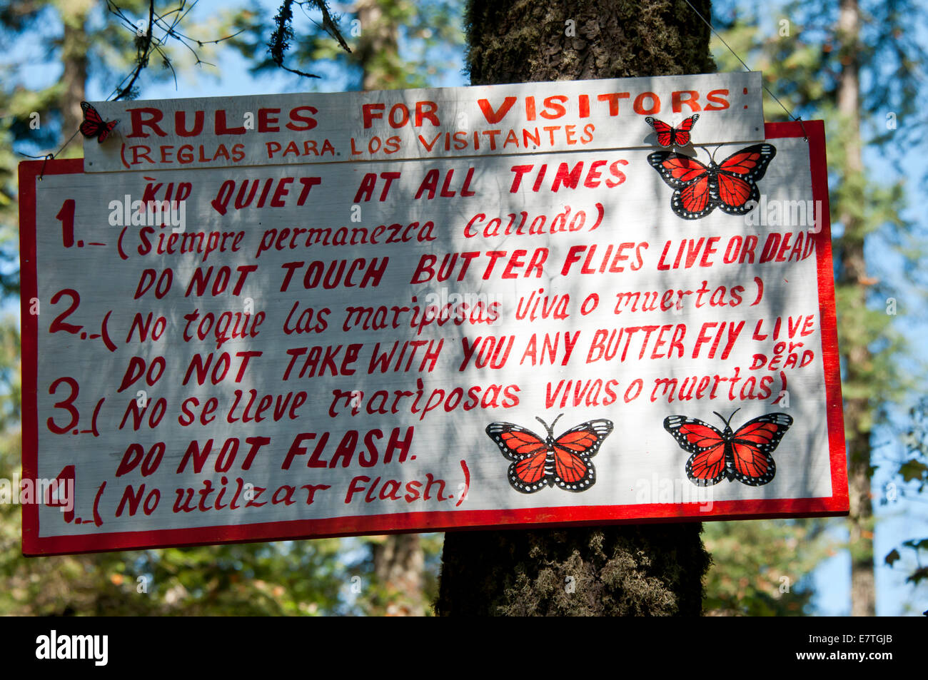 Sign in the El Rosario Monarch Reserve, Mexico complete with misspellings and Monarch illustrations Stock Photo