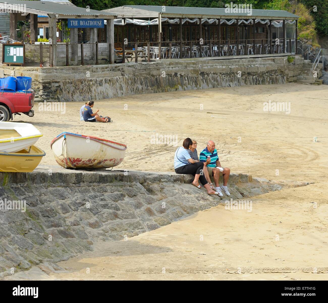People sitting and relaxing in Newquay Harbour Cornwall England uk Stock Photo