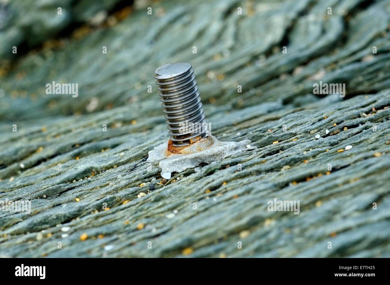 A bolt cemented into the rock face england uk Stock Photo
