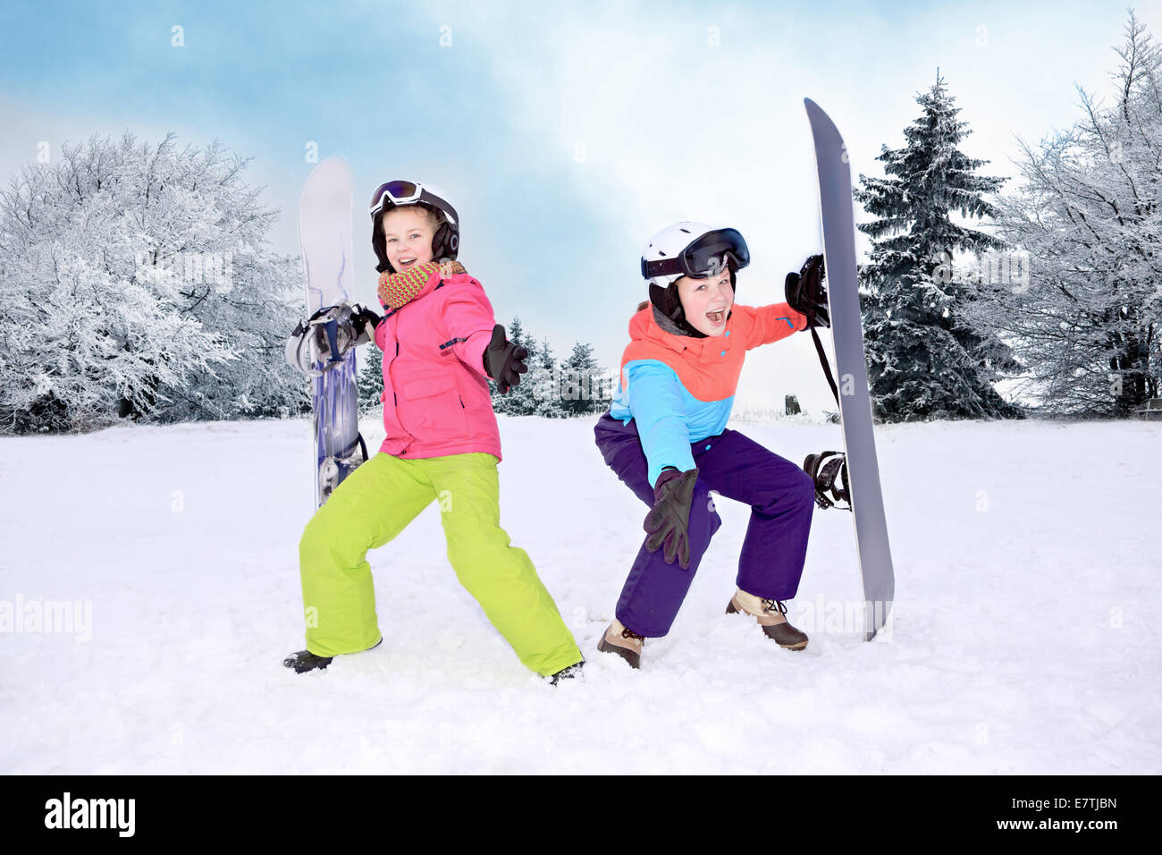 teenage girls snowboarding in the Alps. Stock Photo