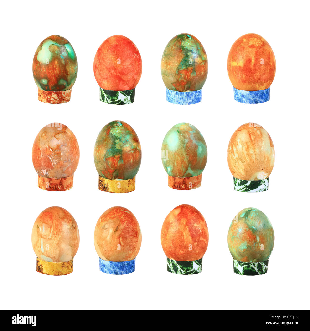 Set of colored easter eggs on stand isolated on white background Stock Photo