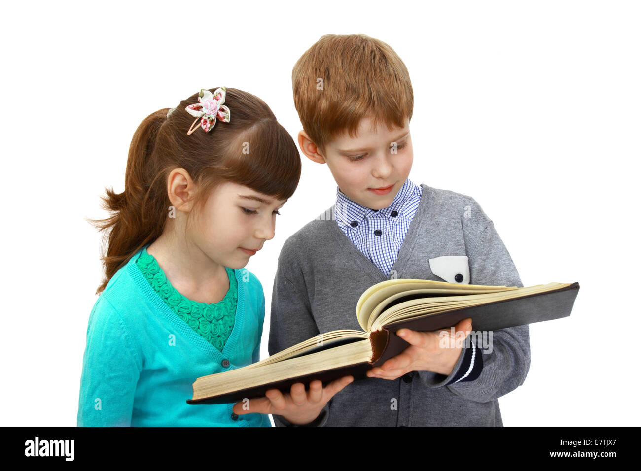 Boy and girl read book isolated on white background Stock Photo
