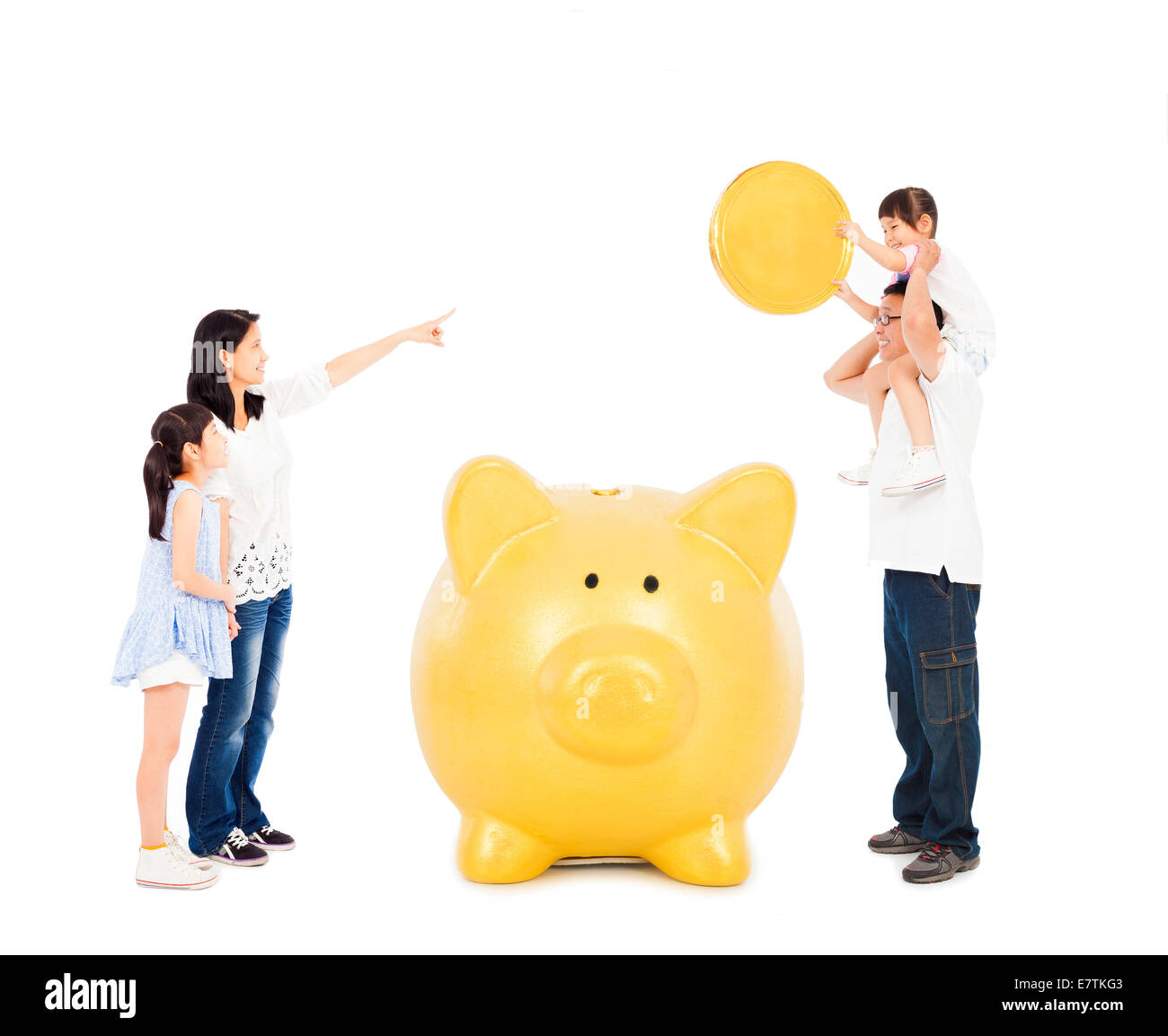 asian parents teaching daughters financial concept with a piggy bank Stock Photo