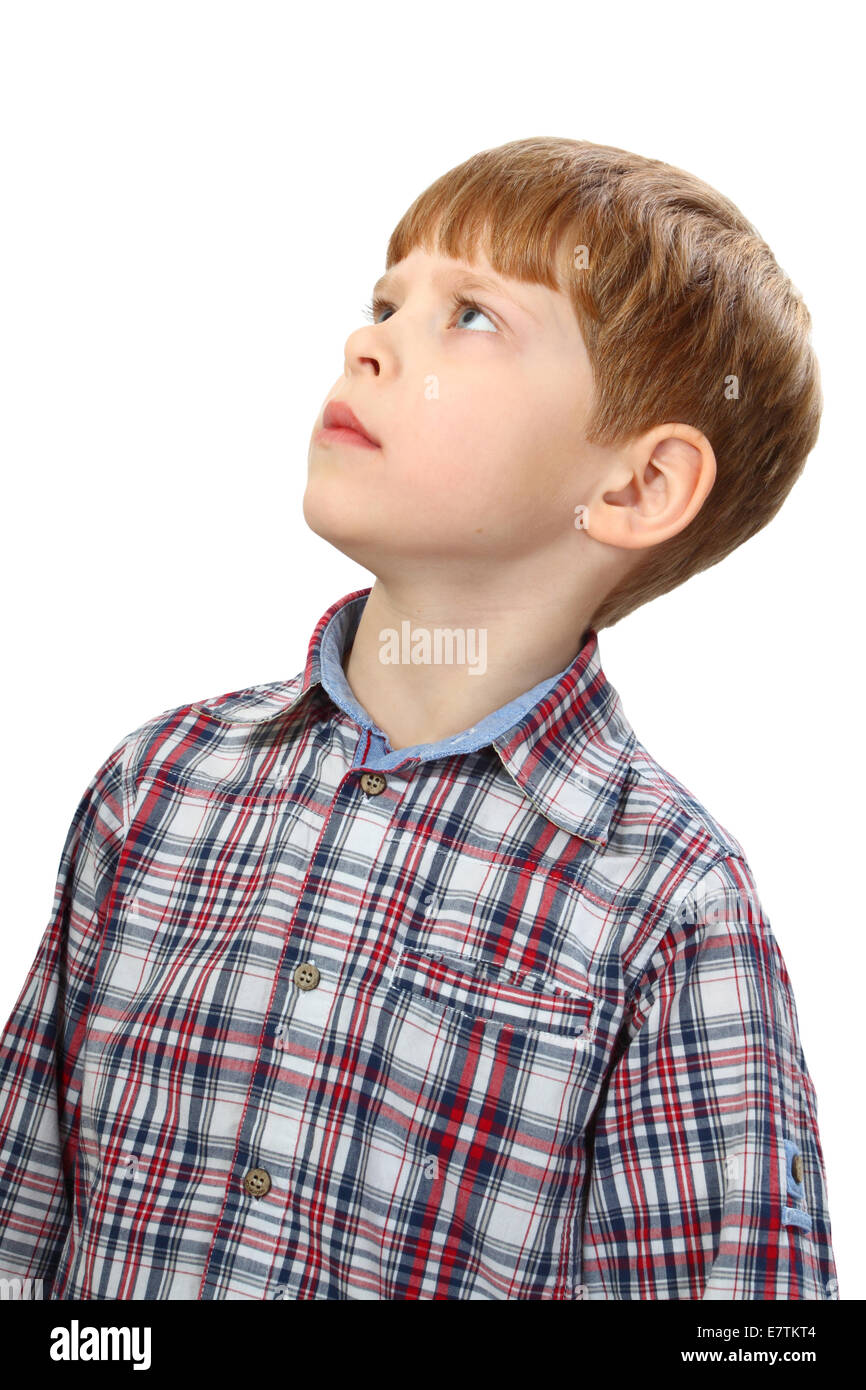 Boy intently looking up isolated on white background Stock Photo
