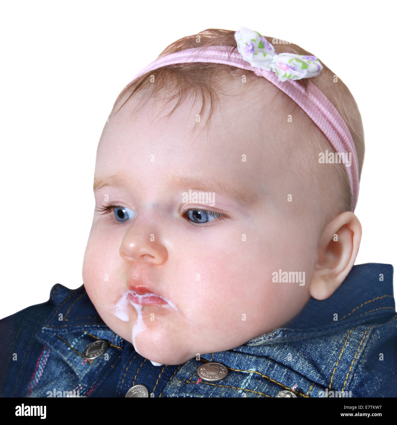 Infant with face smeared in milk closeup portrait isolated on white background Stock Photo