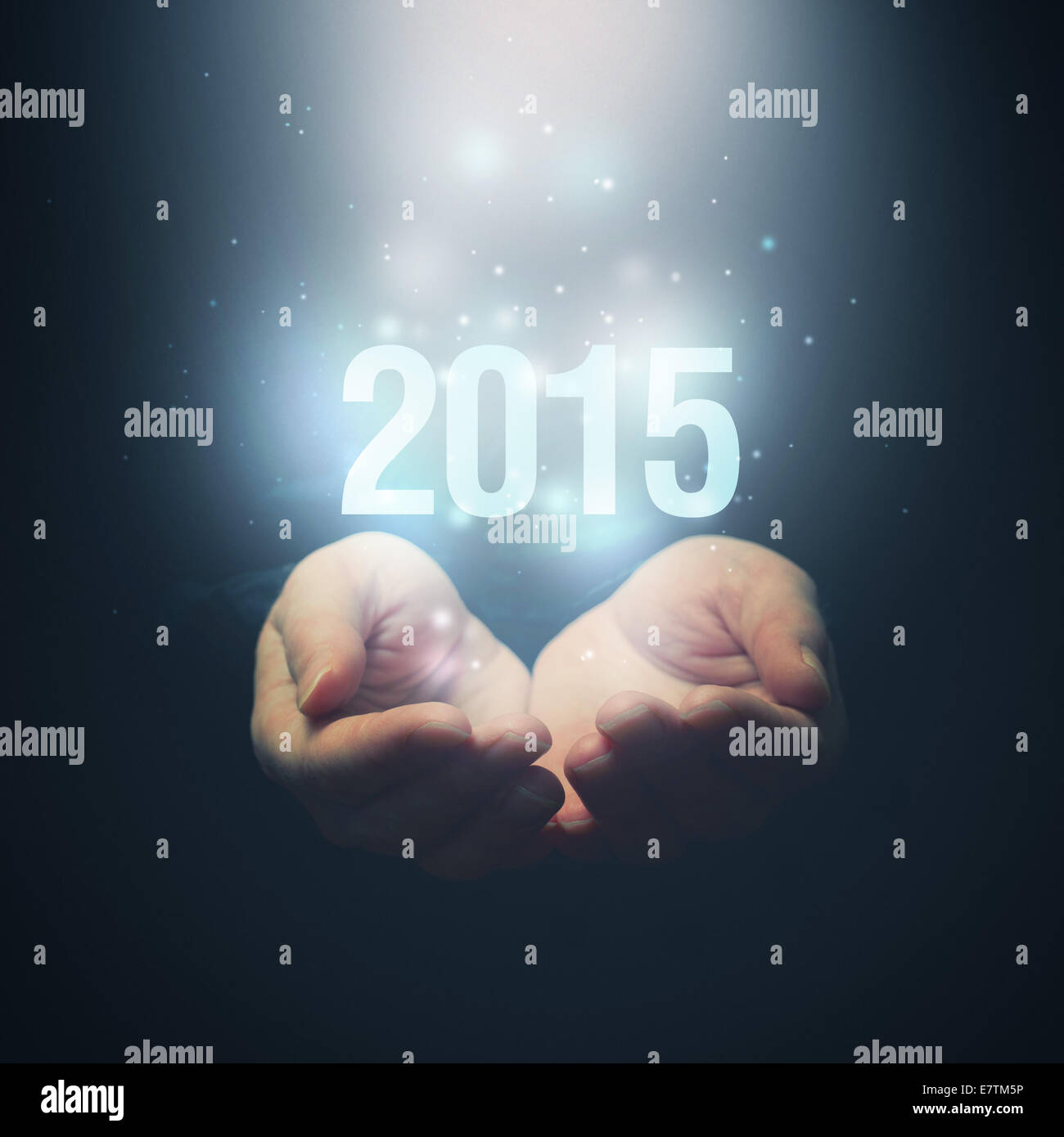 Open hands holding number 2015. Happy New Year.. Selctive focus on fingers. Stock Photo