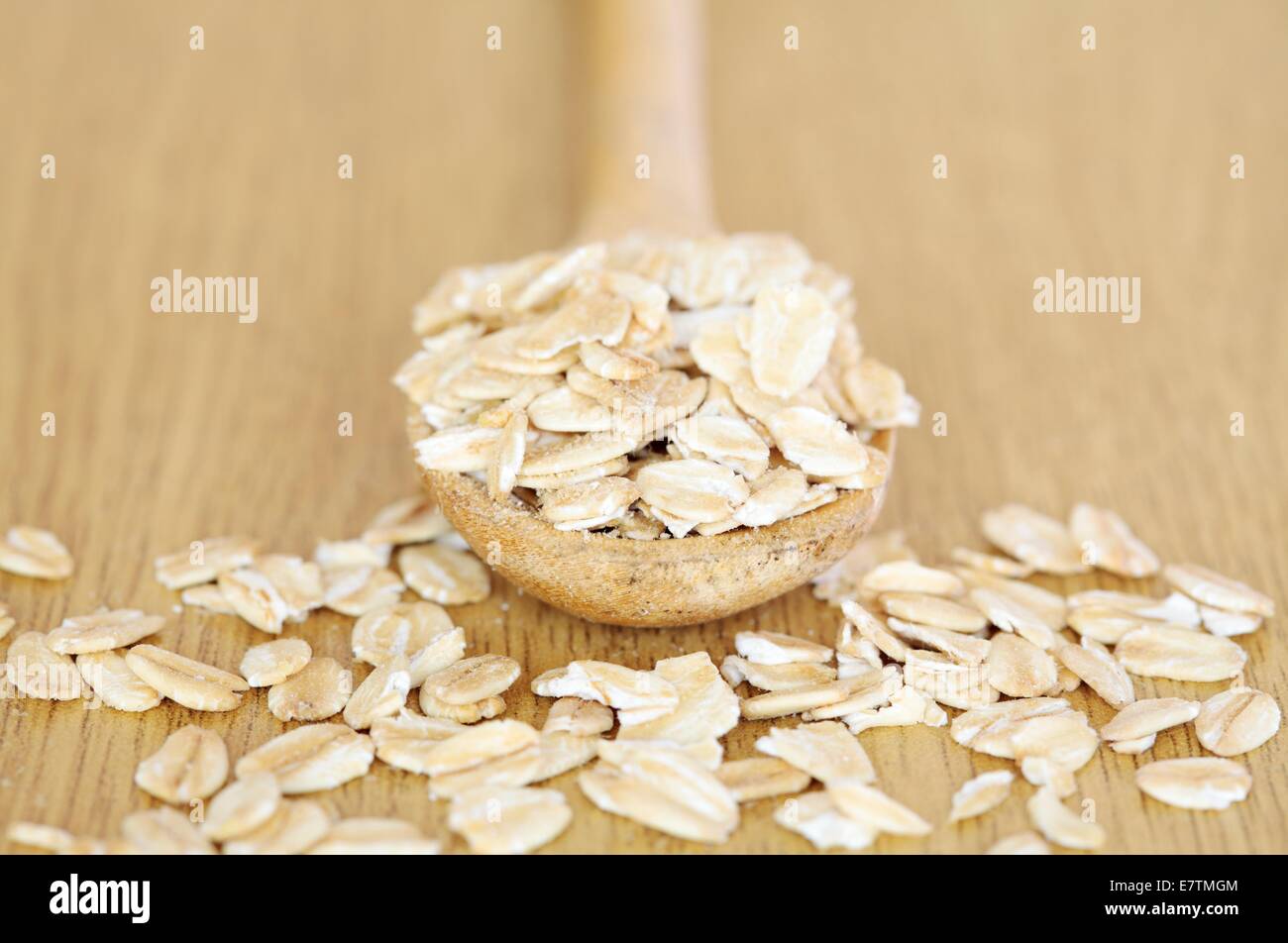 Whole rolled oats (Avena sativa). Stock Photo