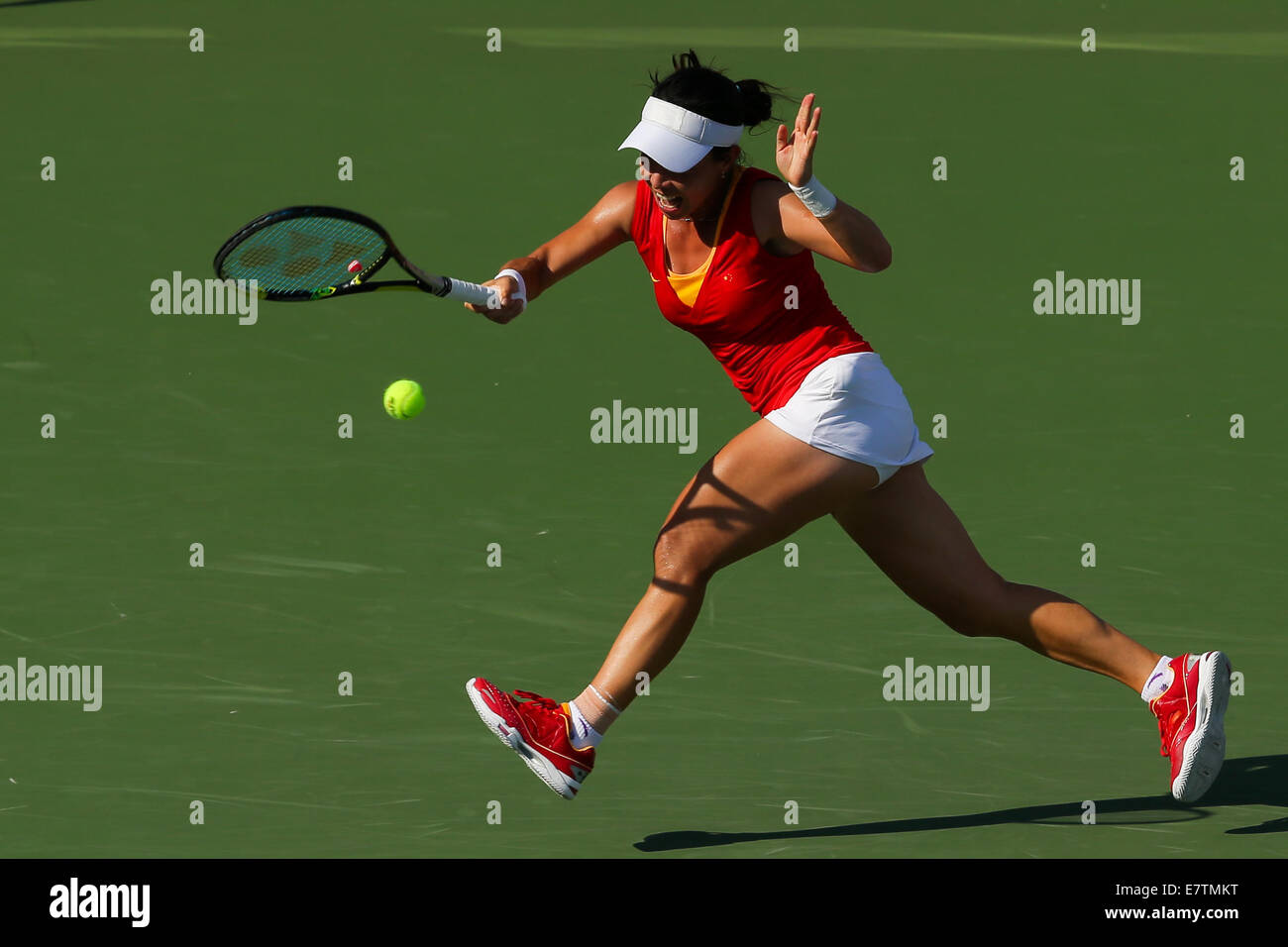 Incheon, South Korea. 24th Sep, 2014. Zheng Jie of China returns the ...