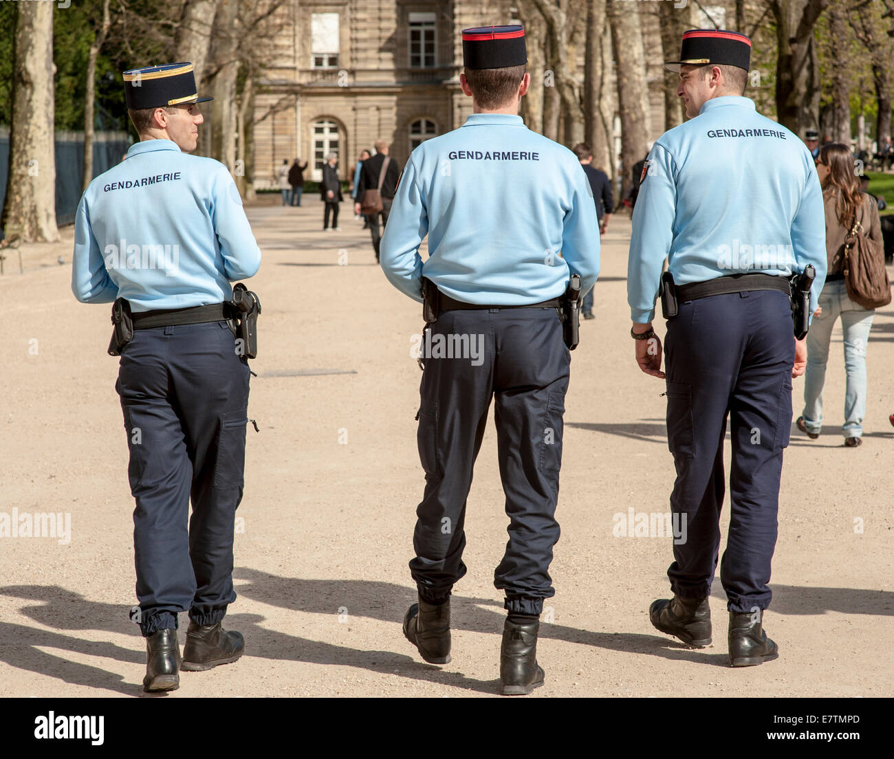 Three Parisian gendarmes in the Luxembourg Gardens in Paris Stock Photo
