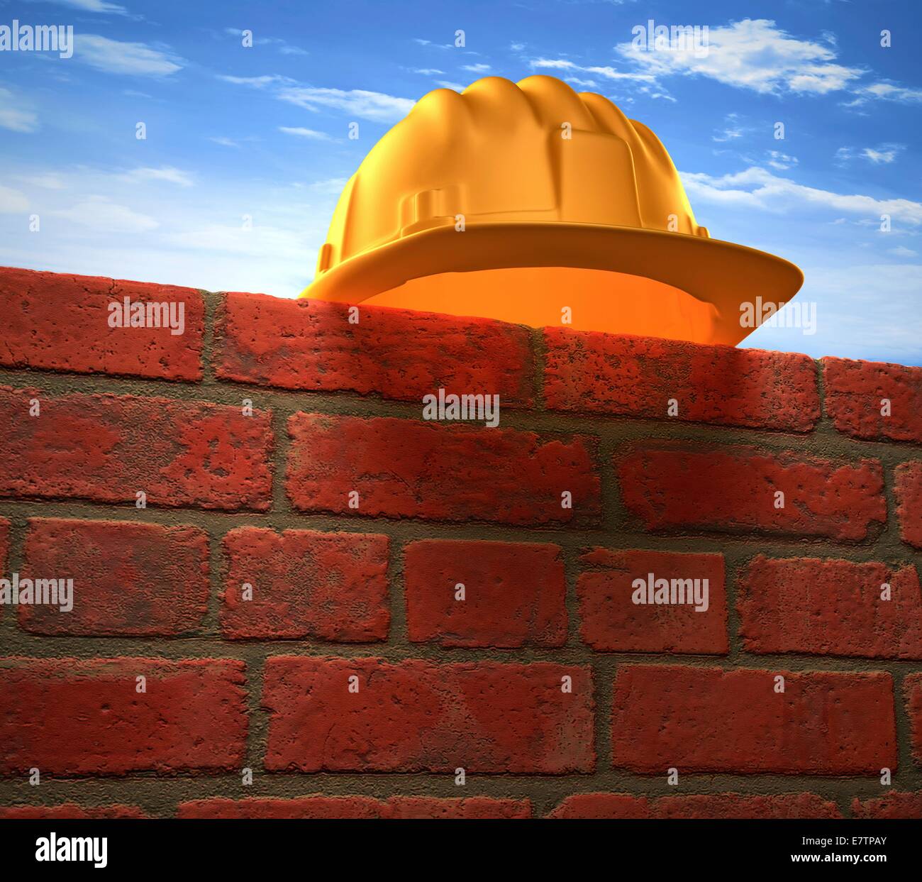Hard hat on a brick wall, conceptual artwork. Stock Photo
