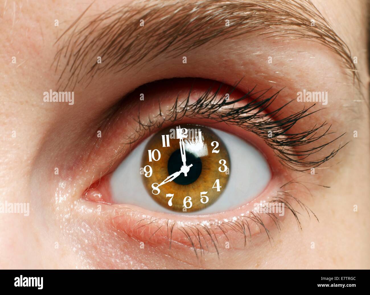 MODEL RELEASED. Eye with clock, composite image. Stock Photo