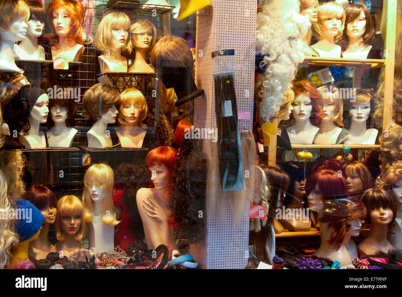 Window display of wigs for sale Stock Photo