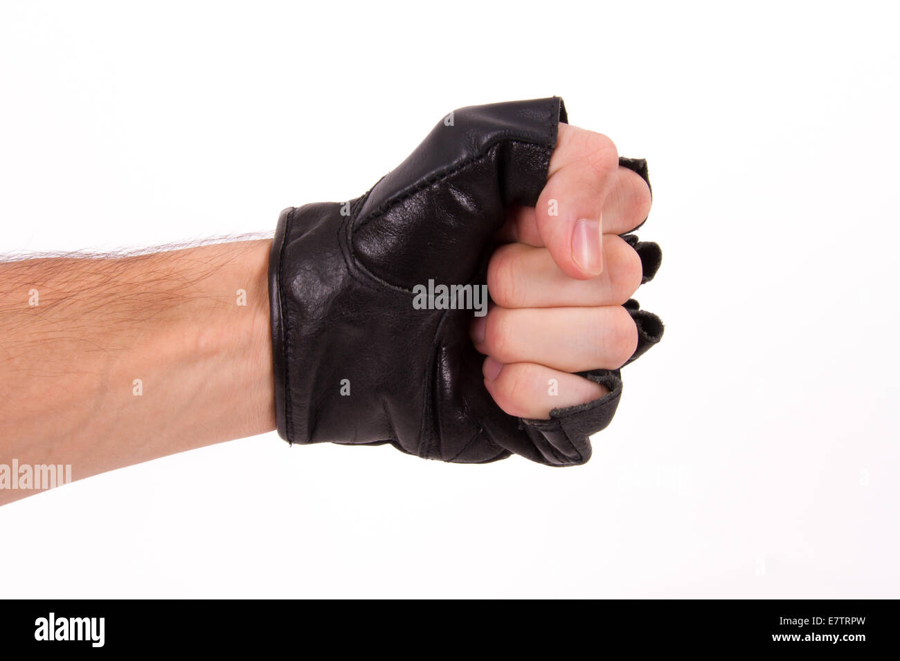 Fist, punch coming out from side with sport glove, isolated on white background. Stock Photo