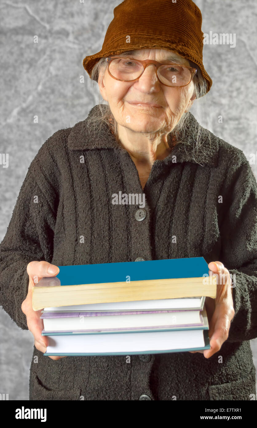 Elderly woman holding documents hi-res stock photography and images - Alamy