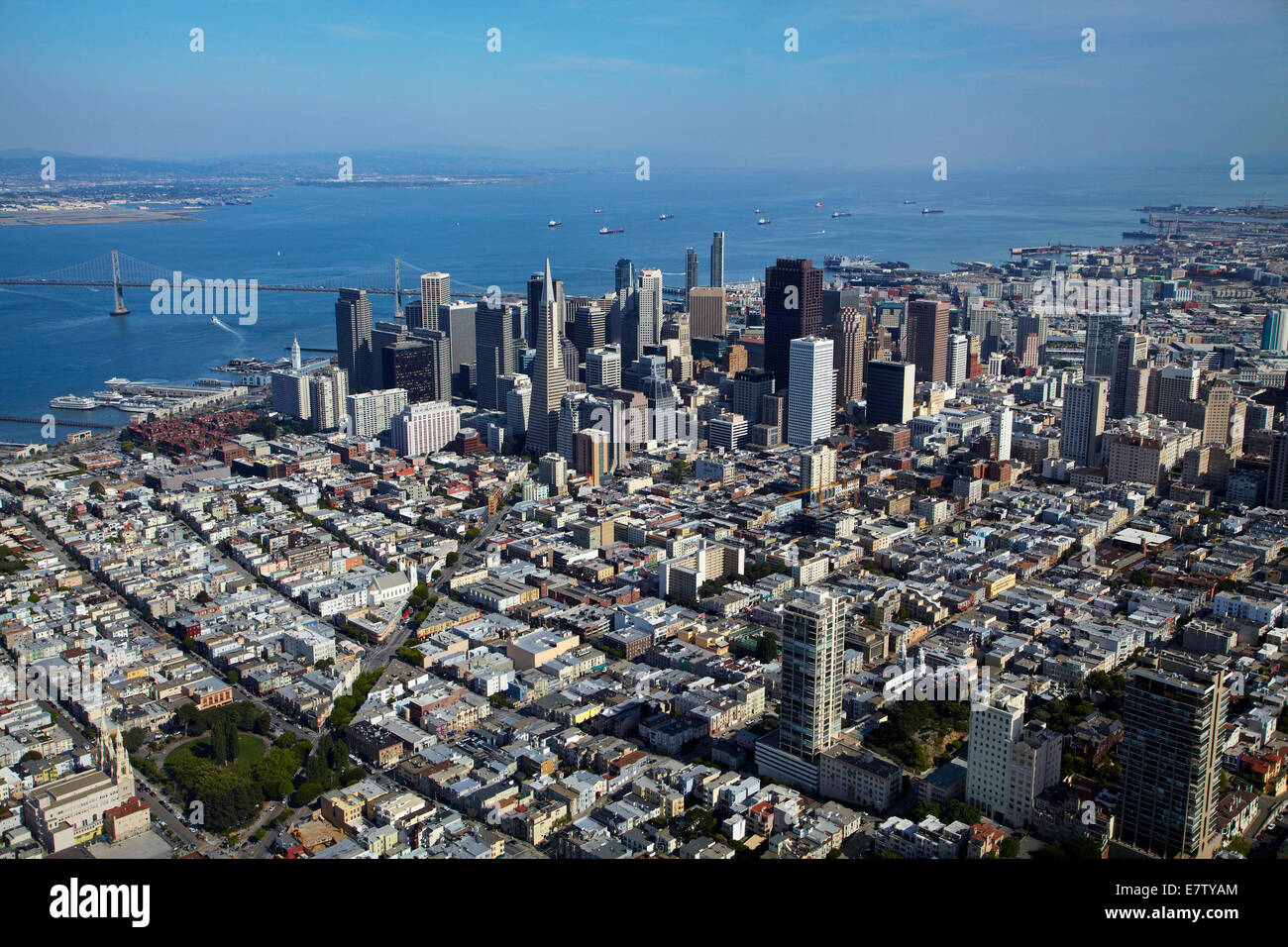 Washington Square Park, and Columbus Avenue leading to downtown San Francisco, and San Francisco Bay, USA - aerial Stock Photo