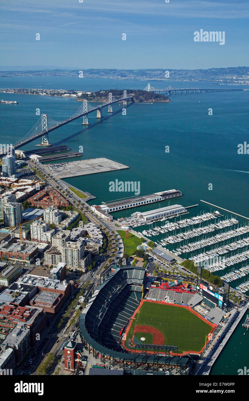AT&T Park / Giants Ballpark, South Beach Marina, downtown San Francisco, and Bay Bridge, California, USA - aerial Stock Photo