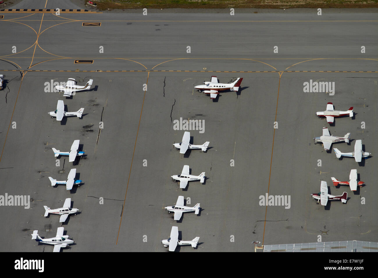 Light planes parked at San Carlos Airport, San Francisco, California, USA - aerial Stock Photo