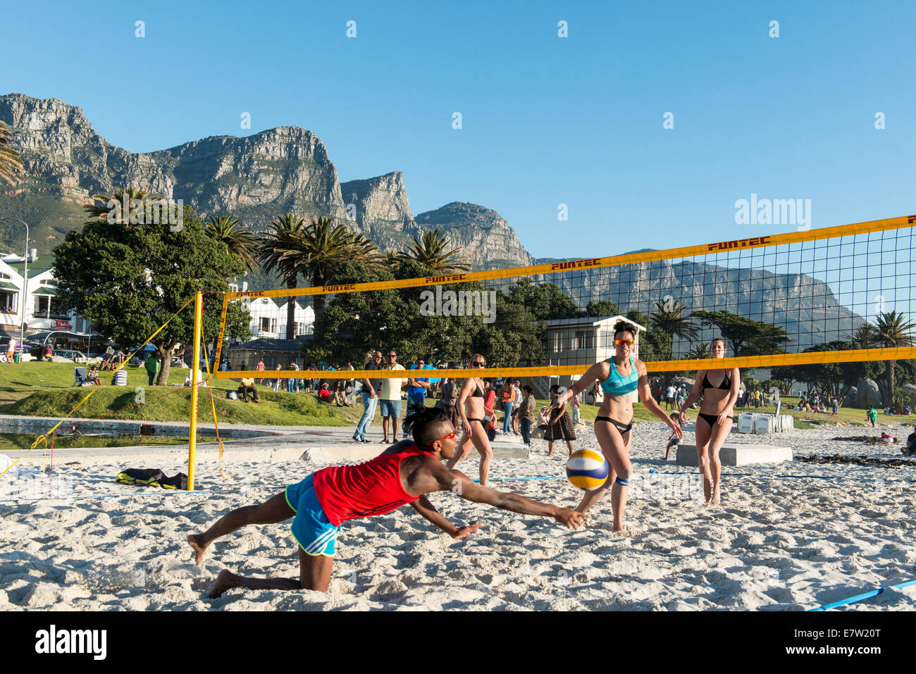Beach volleyball players on the beach of Camps Bay, Cape Town, South Africa Stock Photo