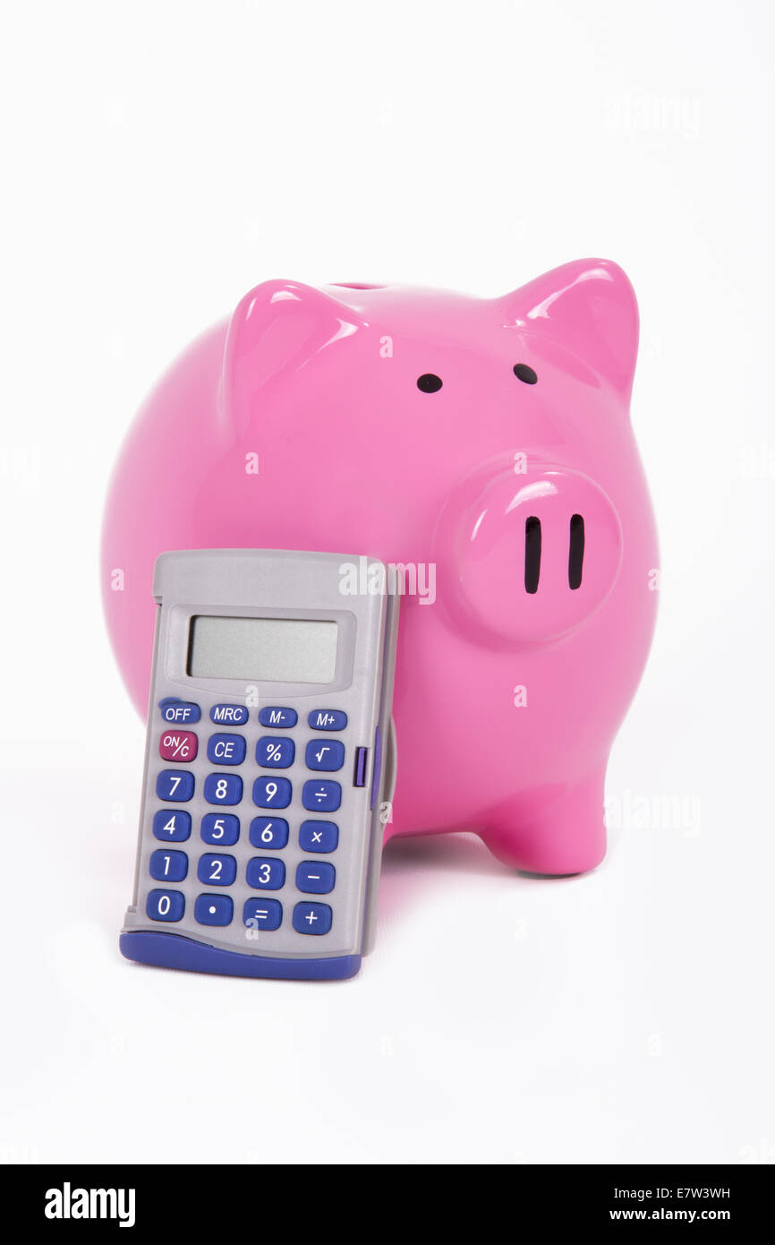 Calculator leans to pink piggy bank, isolated on white background Stock ...