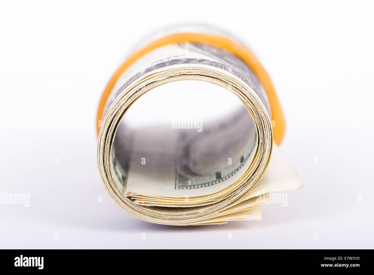 Roll of one hundred dollar banknotes, isolated on white background ...