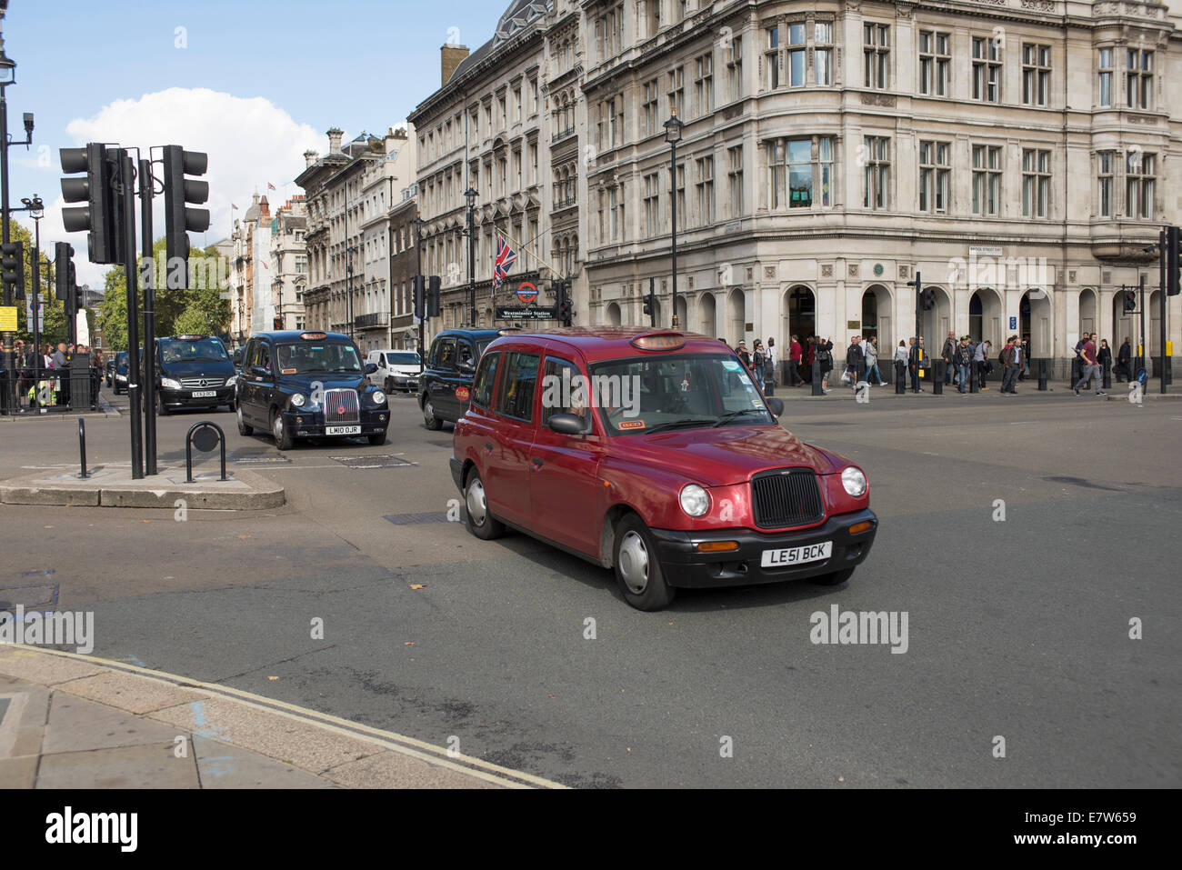 Central London, UK. 24th September 2014. Black cab taxi drivers protest TfL’s taxi policies today by driving in central London at a snails pace around 2pm. Areas affected are around Parliament Square, Whitehall and Trafalgar Square. Taxis start to arrive before 2pm. Credit:  Malcolm Park editorial/Alamy Live News. Stock Photo