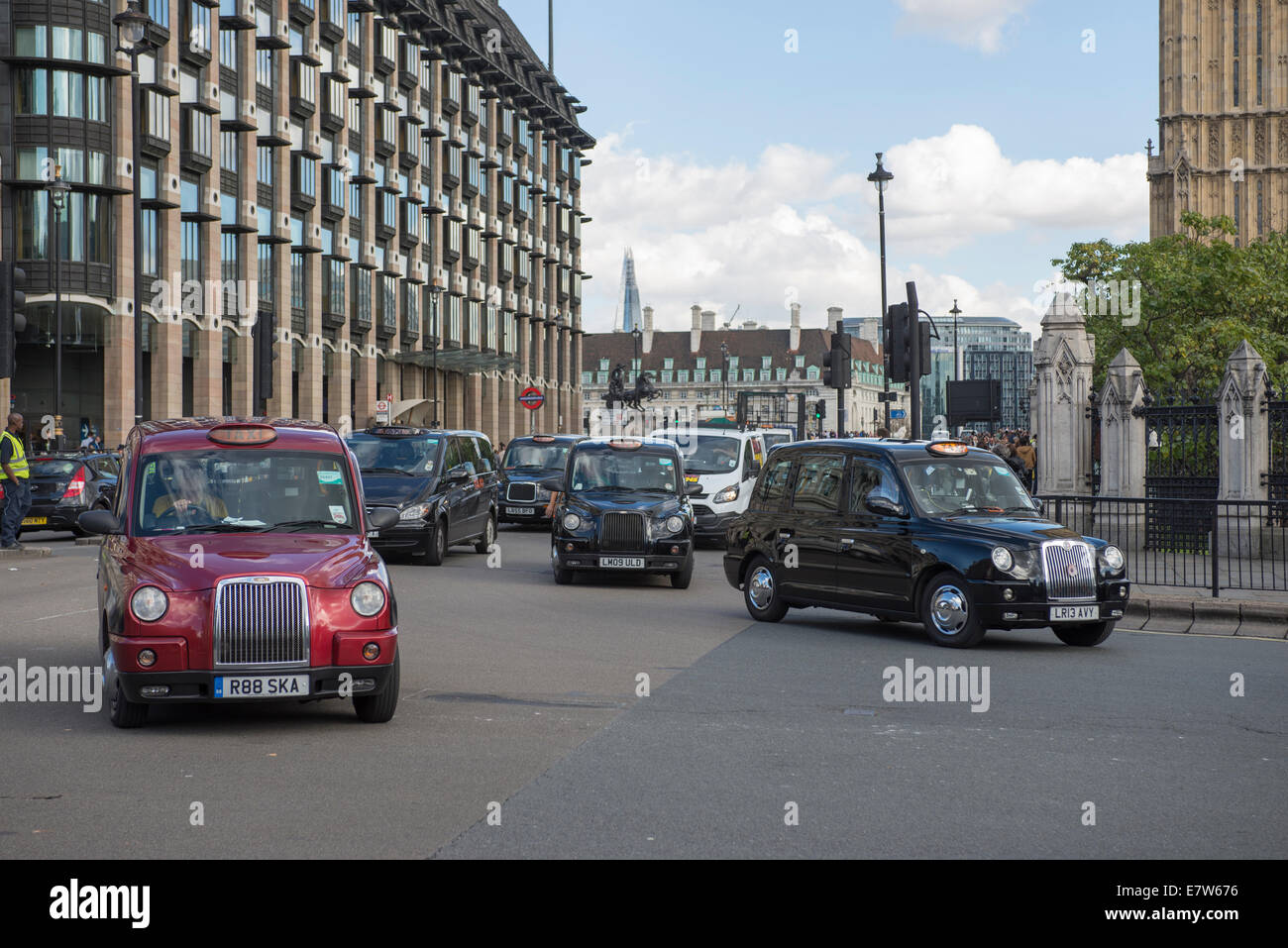 Central London, UK. 24th September 2014. Black cab taxi drivers protest TfL’s taxi policies today by driving in central London at a snails pace around 2pm. Areas affected are around Parliament Square, Whitehall and Trafalgar Square. Taxis start to arrive before 2pm. Credit:  Malcolm Park editorial/Alamy Live News. Stock Photo