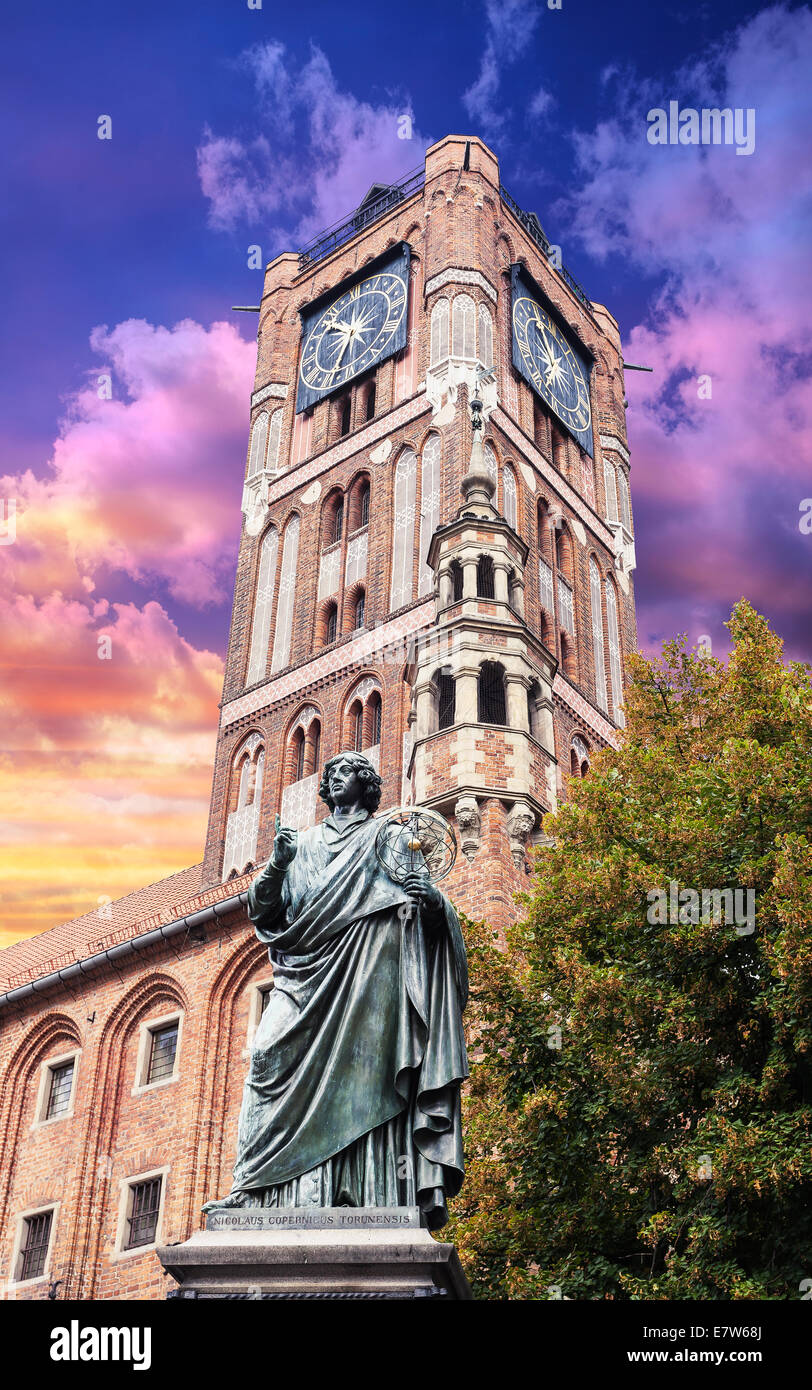 Sculpture of Nicolaus Copernicus in front of the Town Hall in Torun at sunset, Poland. Stock Photo