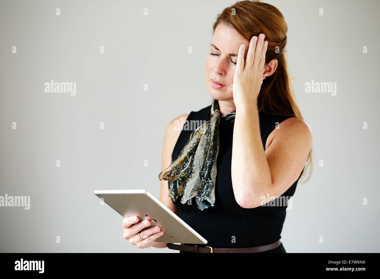 Woman with headache Stock Photo