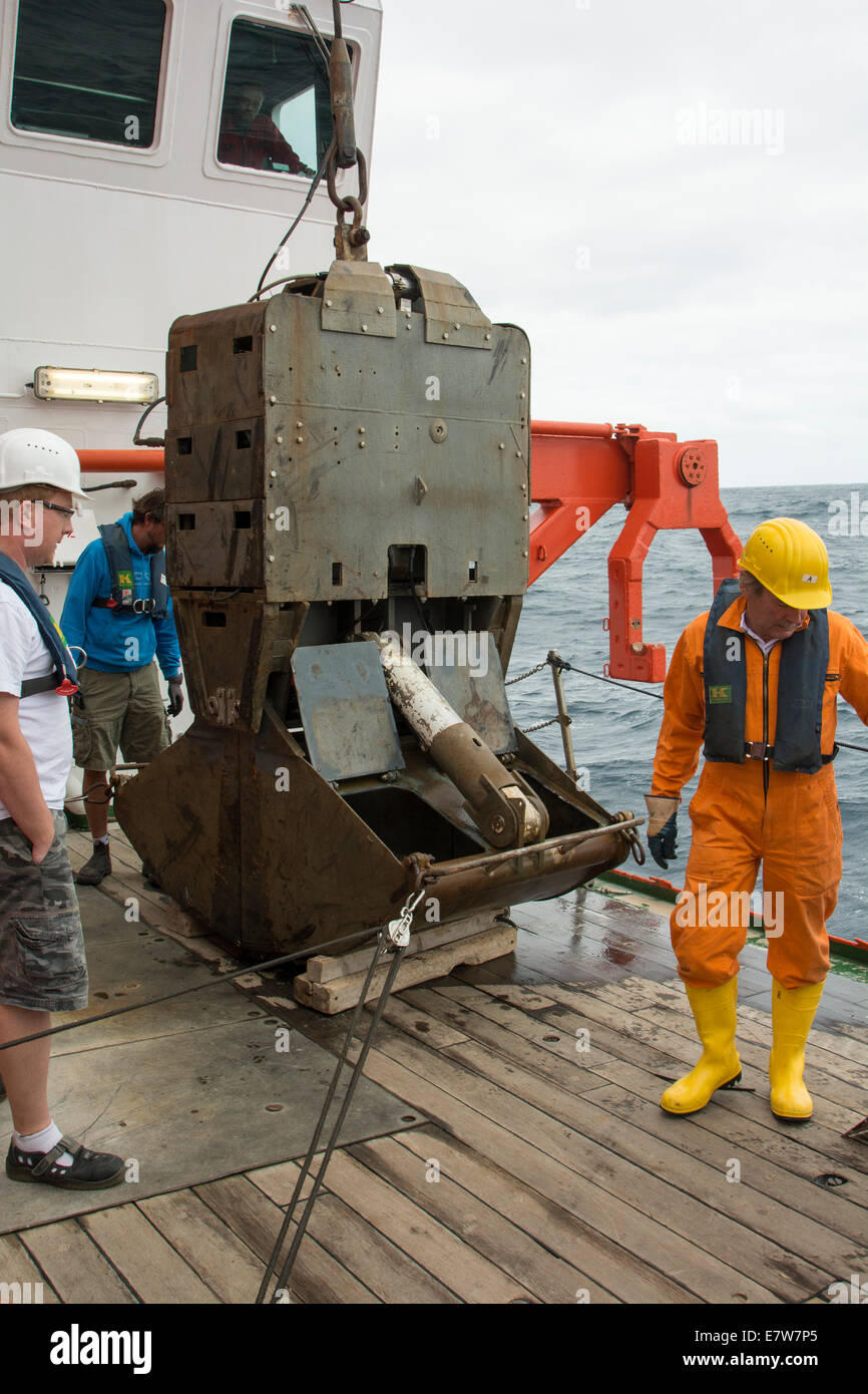 To pick up stones from submarine volcanoes the crew of German research vessel Sonne is hauling a TV-grab from Walvis Ridge. Stock Photo