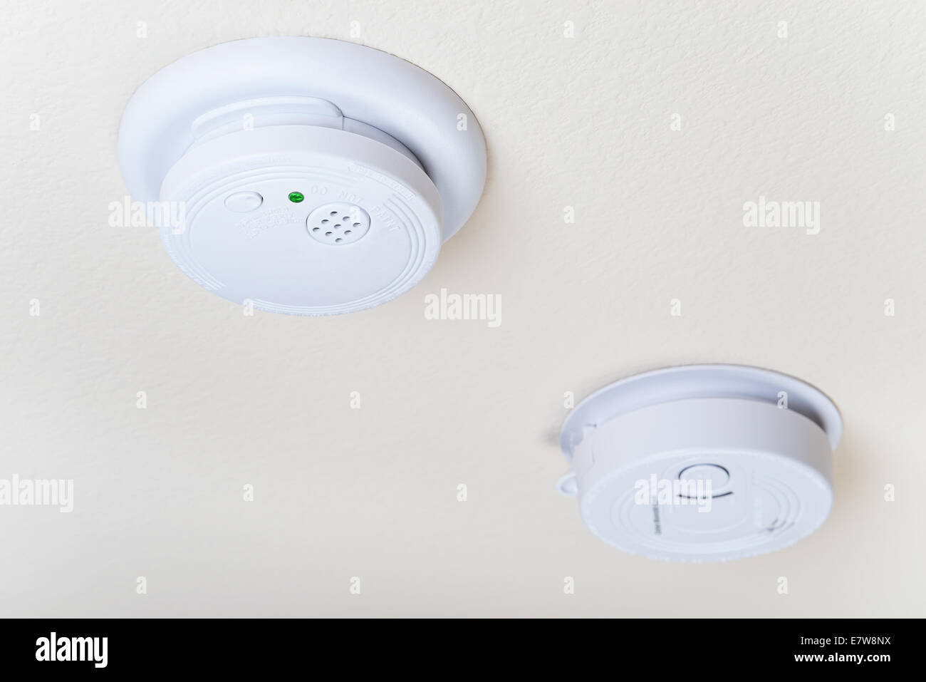 Smoke fire and a carbon monoxide alarm mounted on the ceiling Stock Photo