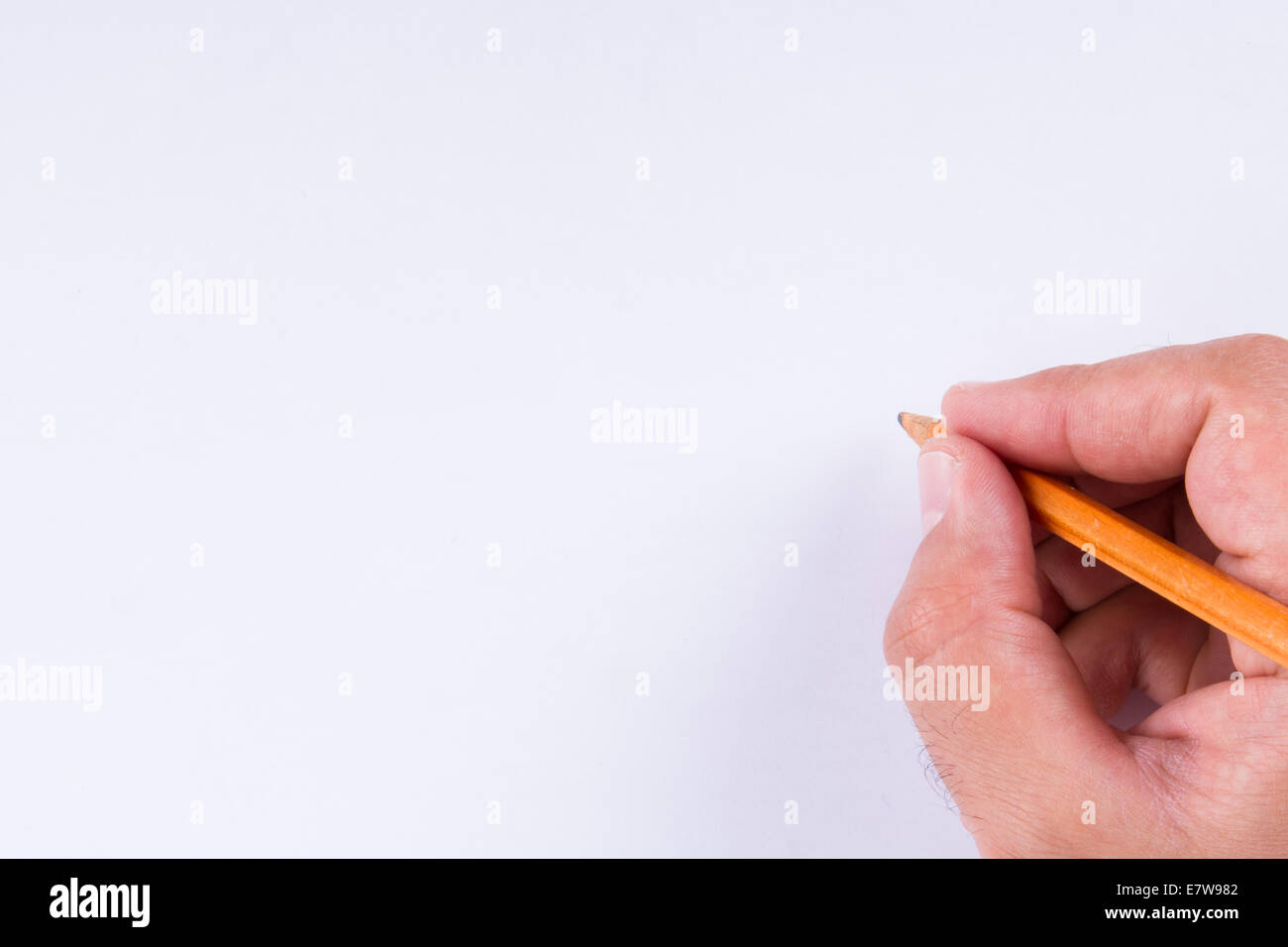 Hand holding pencil, isolated on white background Stock Photo - Alamy